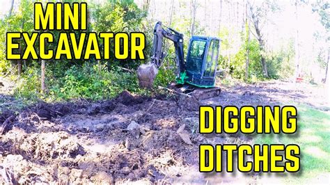 digging a ditch with a mini